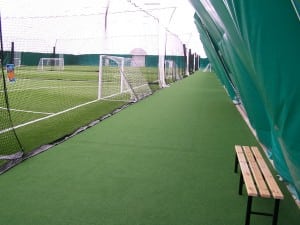 indoor soccer field turf near seating area