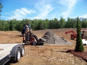 installer bulldozing dirt
