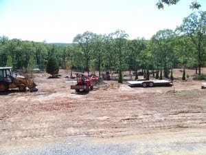 bulldozers on installation site for artificial putting green